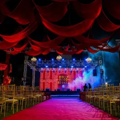 Lights, camera, Bollywood! For this sangeet, I transformed the venue into a filmy wonderland with dramatic red drapes, a red carpet entrance, and a classic marquee bulb backdrop to set the stage for a night of stardom.