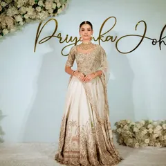 A full-length view of the model showcasing the complete look against our masterclass backdrop. I teach how makeup, hair, and outfit work together to create a cohesive and stunning bridal profile.