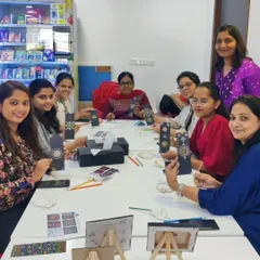 Here you can see a group of colleagues gathered around a table, completely engaged in the creative process. I set up everything right in your office space, making it easy to host a memorable and effective team building event.