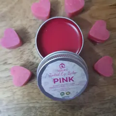 This is my Pink Tinted Lip Balm, made with nourishing ingredients like cocoa butter and Vitamin E oil. It provides a lovely hint of color while keeping your lips soft and moisturized.