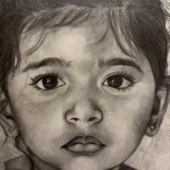 An extreme close-up on the eyes of the baby portrait. This is where the soul of the sketch lies, and I spend a lot of time making sure they reflect the child's true spirit.