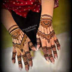An elegant and classic design for any festive occasion. The hanging 'jhumki' style patterns and delicate net work on the fingers make this a timeless choice.