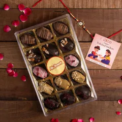 A festive flat lay of a Mr Brown chocolate dates hamper, styled with a rakhi and rose petals. This image is perfect for seasonal marketing, directly targeting the Raksha Bandhan gifting market.