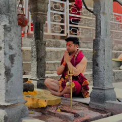 In prayer at a temple. My faith is my anchor, providing strength and clarity in both my personal and professional life.