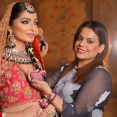 A happy moment with the bride as I apply her blush. I believe in creating a relaxed and enjoyable atmosphere for my clients on their big day.