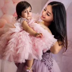 The bond between a mother and daughter is so special. This beautiful portrait of Mahhi holding Tara captures that love perfectly. I always aim to photograph these quiet, tender moments during a family session.