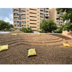 The beginning of the 'rising green'. This image shows the carport roof being prepared with soil, contoured and ready for the lawn to be laid. This is the foundational work for creating a sloping garden.