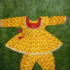 A matching yellow printed kurta and pajama set designed for a one-month-old baby. This was created as part of a coordinated sibling set with a sharara for the older sister.