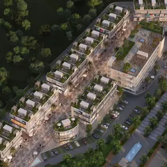 This is a top-down aerial rendering of a mixed-use commercial development. This perspective is invaluable for urban planning and traffic flow analysis, showing how pedestrian zones, retail blocks, and roadways interact within a masterplan.