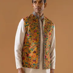 A vibrant yellow Jawahar jacket featuring a classic paisley and floral print. The detailed border adds a touch of refinement, making it a perfect choice for a festive daytime event.