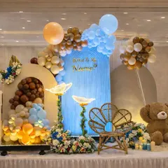 A lovely naming ceremony setup combining a teddy bear theme with other playful elements. We included custom 'BABY' blocks, a blue corrugated backdrop, and floral details to create a unique and personalized stage.