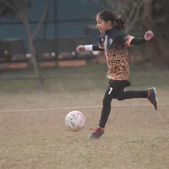 The art of football, beautifully demonstrated by one of our talented girl players. Her control and focus are excellent.
