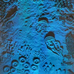 The final installation, titled 'Silent Architects of the Sea', under dramatic blue light. We used lighting to simulate an underwater environment and to highlight the beautiful, intricate textures of the coral wall we created. The effect was designed to be both beautiful and haunting.