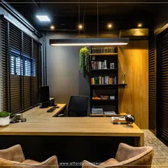 A glimpse into a high-end office cabin we designed in BKC, Mumbai. The design features dark, moody tones, a statement pendant light, and an efficient L-shaped desk, proving that professional luxury can be achieved within a budget.