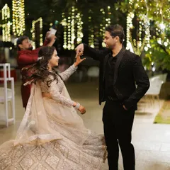 A couple shares a dance, lost in each other's eyes under the warm glow of twinkling lights. My goal is to create an atmosphere where these magical moments can unfold naturally.