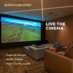 We believe in creating spaces where you can truly live the cinema. This modern media room features a massive 4K screen, plush, comfortable seating, and integrated ceiling lights, all designed to deliver a state-of-the-art, high-quality audio and video experience.