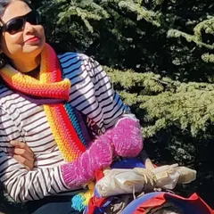 A customer enjoying the outdoors in our rainbow muffler and matching fingerless gloves. The perfect cozy combo.