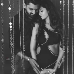 This black and white version of a glamorous couple's shoot adds a layer of classic Hollywood elegance. The lighting and emotion are the true stars of the photo.