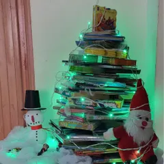 Our library's Christmas tree, made entirely out of books! It's a perfect symbol of our love for stories and the festive season.