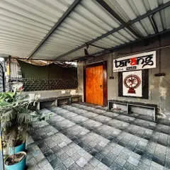 Our covered entrance area provides a space to transition before you even step inside. The artwork of Nataraja, the lord of dance, greets you, hinting at the creative energy within.
