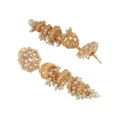 An angled shot of the same tiered jhumka earrings, revealing their three-dimensional structure and the craftsmanship of the pearl settings.