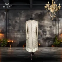 This majestic light gold sherwani is crafted from luxurious silk and adorned with multicolour intricate details. Paired with a silk kurta, it embodies the grandeur and opulence of Persian royalty.