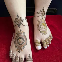 A minimalist yet chic engagement leg design. It features a central lotus mandala on the foot, connected to a delicate anklet pattern, with simple designs on the toes.