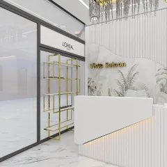 The chic and welcoming reception area of one of our salons, featuring modern design and our partnership with trusted brands like L'Oreal.