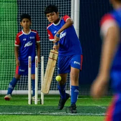 How's that for a shot? A young footballer swaps his boots for a bat and pads during our multi-sport celebration on National Sports Day.