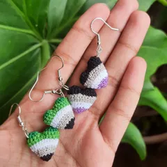 I also turn my pride hearts into earrings. This photo shows matching sets of aromantic and asexual pride heart earrings, a beautiful way to celebrate your identity.