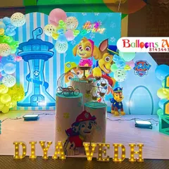 A closer view of the Paw Patrol setup, showing the custom backdrop and balloon arrangement.