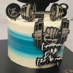 A cake for the gym lover in your life. This design is perfect for a cheat day, featuring custom toppers of weights, a barbell, and a bodybuilder silhouette.