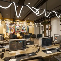 We believe a workspace should inspire creativity. For this IT office in Noida, we designed an open-plan workstation area with custom "IDEA" lighting to create a vibrant, high-energy environment that fosters collaboration and innovation.