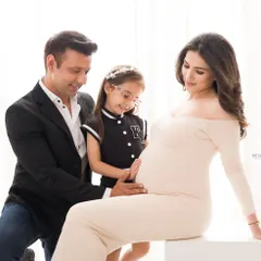 A moment of pure wonder as the whole family connects with the baby on the way. These family portraits are about capturing the shared excitement and love that fills this special time.