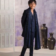 Another angle of the navy blue embellished Indo-western set. The long jacket, or sherwani style coat, is layered over a simple kurta, making it perfect for a winter wedding.