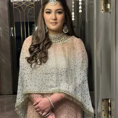 A full-length portrait showing the complete engagement look. The soft glam makeup perfectly complements her elegant Tarun Tahiliani outfit.