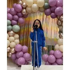 This student commands the stage during her monologue presentation, showcasing the powerful storytelling skills she has developed.