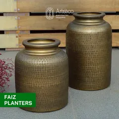 The Faiz planters have a classic pot shape with a hammered brass finish, making them a timeless choice for both indoor and outdoor plants.