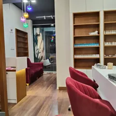 Another view of our salon interior, showing the reception area and our extensive wall of nail polish colors.