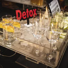 A close-up of our detox water station, featuring chilled water infused with lemon and cucumber. It's a thoughtful and healthy option for guests at any party.