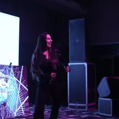 The lead female vocalist captivating the audience with her performance.