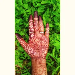 This is the fresh stain of an Indian mehendi design just six hours after removing the paste. The color is a vibrant orange, which will continue to darken over the next two days.