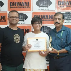 Our student with his father and one of our senior members, celebrating his achievement at the prize distribution ceremony.