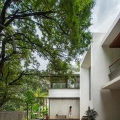 Our project, 'A House Reborn', was a sensitive renovation of a 60-year-old structure. We preserved the home's original footprint while adding modern, light-filled spaces that open up to the lush, mature trees on the property.