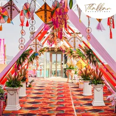A vibrant and colorful entranceway for a wedding. I used hanging kites, dreamcatchers, and colorful drapes to create a festive and welcoming passage for guests, leading to the main event area.