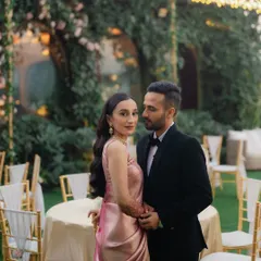 A classic, elegant portrait of the couple at their reception at Gallops, Mumbai. Their formal attire and the romantic lighting create a timeless feel.