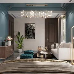 A luxury bedroom interior that combines classic panel molding in a deep teal with modern furniture. The design creates a space that feels both timeless and contemporary, with a cozy seating area for relaxation.