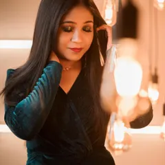 This photo captures the mood of a cocktail look perfectly. The dark, blended eyeshadow and the subtle red lip create a look of effortless glamour.