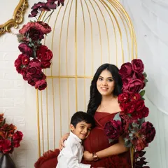 The sweet connection between a mother and her son. He gently hugs her baby bump, creating a precious memory before the new baby arrives.