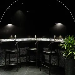 This is your corner of the Lair. Our design is intentional, creating intimate spaces with low lighting and modern textures for private conversations and memorable nights.